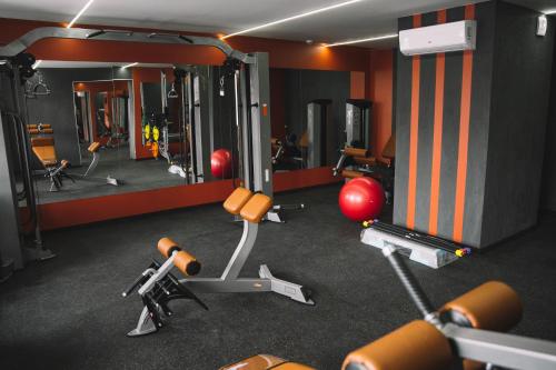a gym with several exercise equipment in a room at Bratislava Hotel Kyiv in Kyiv