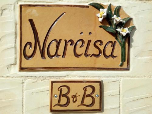 a sign on a wall that reads mariasba bc at Narcisa Farmhouse B&B in Nadur