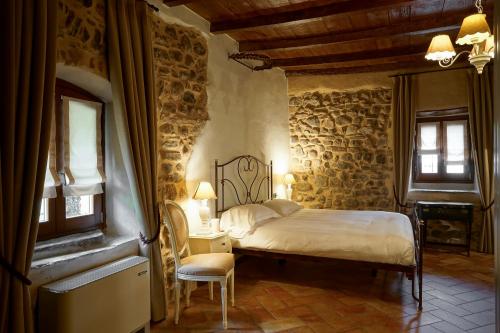 Giường trong phòng chung tại Locanda Osteria Marascia