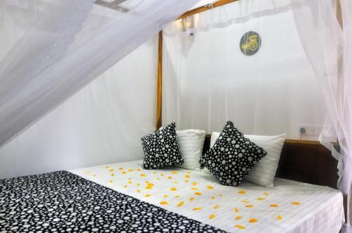 Ένα ή περισσότερα κρεβάτια σε δωμάτιο στο Sunny Homestay