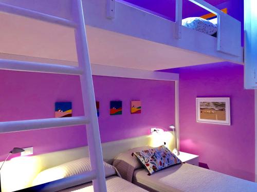 Posteľ alebo postele v izbe v ubytovaní Approdo29 Cesenatico - all’ultimo piano del grattacielo