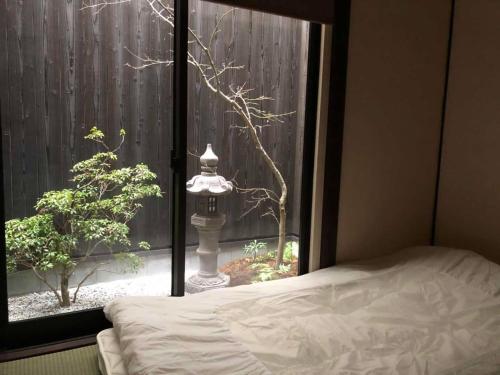 Postel nebo postele na pokoji v ubytování FUUTEI Japanese-style lodge
