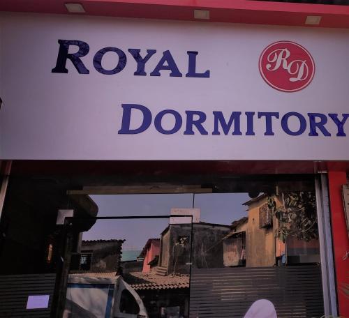 a sign for a royal donut shop at Royal Dormitory in Mumbai