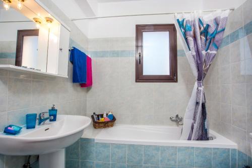 Kylpyhuone majoituspaikassa Blue Horizon Apartment