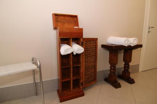 a bathroom with a towel rack and white towels at hotel ristorante vittoria in Santhià