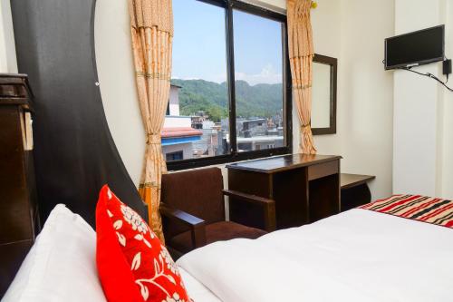 Postel nebo postele na pokoji v ubytování Hotel Admire Pokhara Pvt. Ltd.