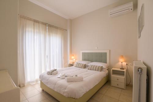 Ένα ή περισσότερα κρεβάτια σε δωμάτιο στο Like Home