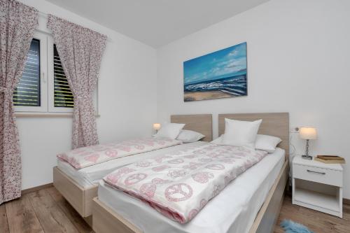 Cama ou camas em um quarto em Apartment Amari Seaview