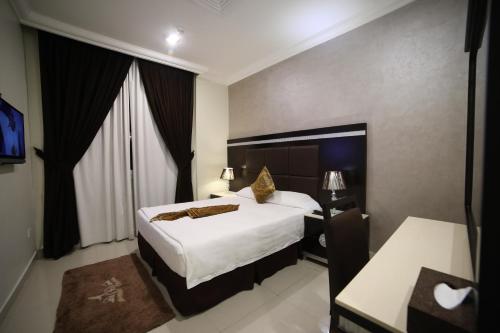 Katil atau katil-katil dalam bilik di Wahaj Hotel Apartments 2