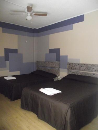 Katil atau katil-katil dalam bilik di Hotel Palacio
