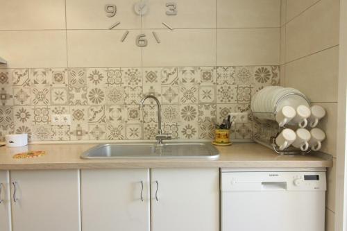 a kitchen with a sink and a counter top at Beach and Family in Vélez-Málaga