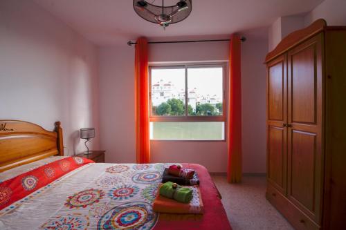A bed or beds in a room at Beach and Family