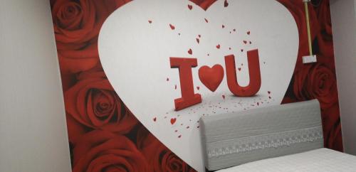 a heart shaped sign with the word i love at Home Inn Hotel in Ipoh