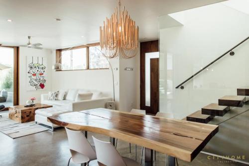 a dining room with a wooden table and chairs at Designer Style Luxury MODERN 5 Star Salt Lake City in Salt Lake City