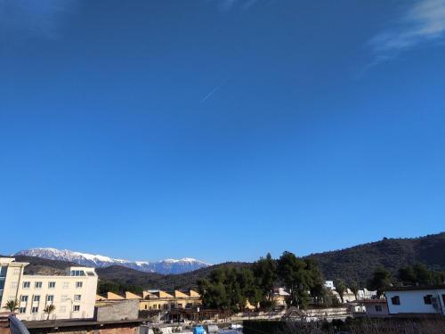 a view of a town with mountains in the background at bed & breakfast Local Living Edi in Berat