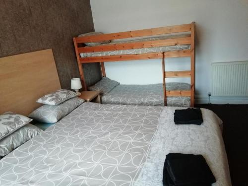 a bedroom with two bunk beds in a room at The Penrhyn in Blackpool