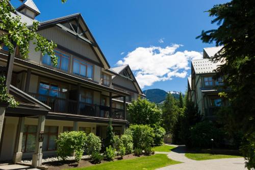 a building with a pathway in front of it at Northstar at Stoney Creek by Whiski Jack in Whistler
