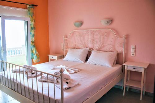 Ένα ή περισσότερα κρεβάτια σε δωμάτιο στο Syvota Sunset Apartments