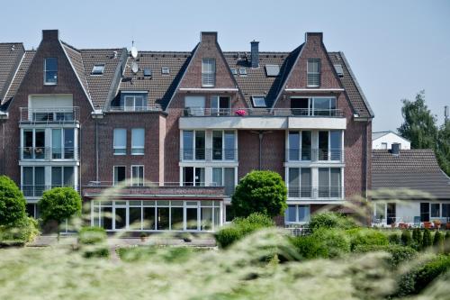 a large red brick building with a lot of windows at Chrisma in Düsseldorf
