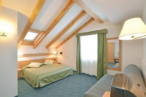 Katil atau katil-katil dalam bilik di Hotel Malga Passerella