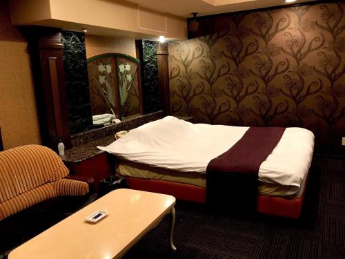 Lova arba lovos apgyvendinimo įstaigoje Hotel Patio Ise (Adult Only)