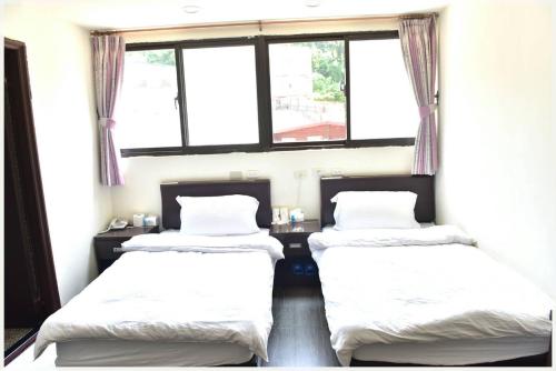 Postel nebo postele na pokoji v ubytování Lian-Yuan Homestay No. 1