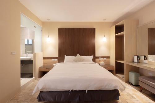 Una cama o camas en una habitación de HUA B&B