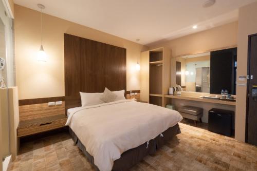 Una cama o camas en una habitación de HUA B&B