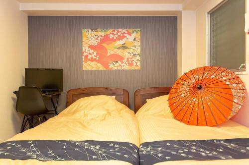 En eller flere senger på et rom på Miyabiro 107