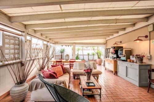 a living room with couches and a table at City Guest House in Rome