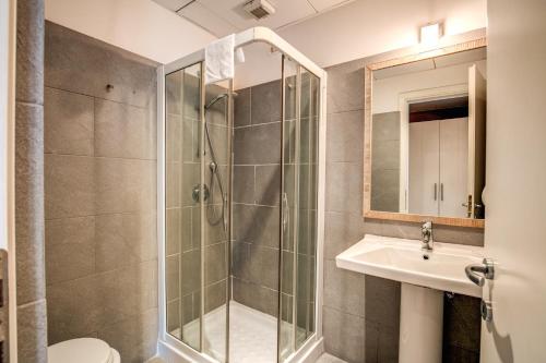 a bathroom with a shower and a sink at City Guest House in Rome