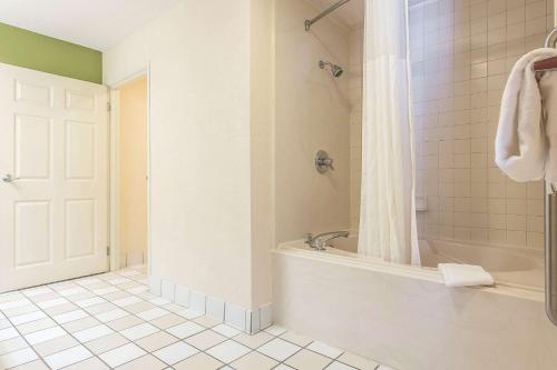 a bathroom with a shower and a bath tub at Sleep Inn & Suites North Augusta in North Augusta