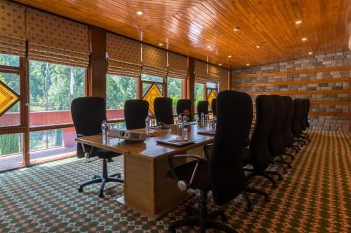 a conference room with a long table and chairs at Gilgit Serena Hotel in Gilgit