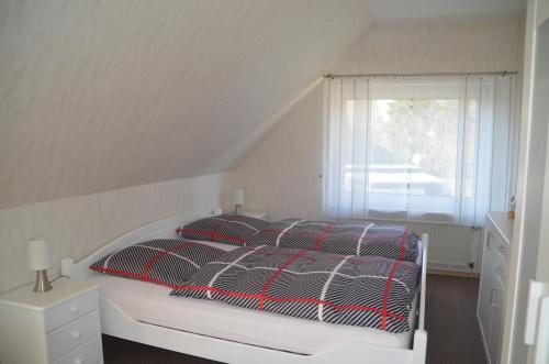 Postel nebo postele na pokoji v ubytování Ferienwohnung Grensemann