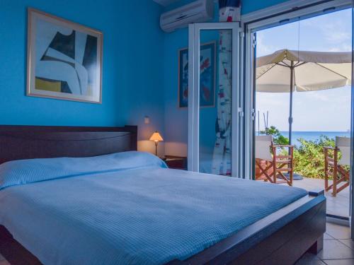 A bed or beds in a room at Kounopetra Beach Luxury Villas
