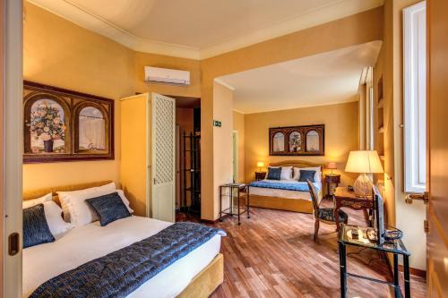 a hotel room with two beds in a room at Elegant Flat by the Vatican dx in Rome