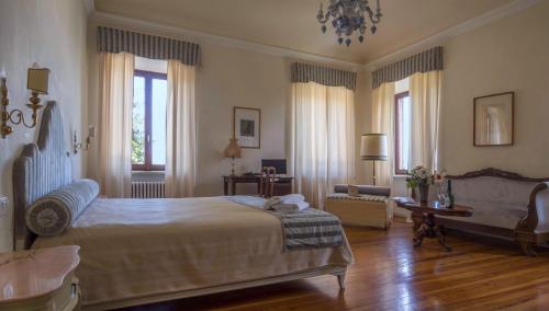 Postel nebo postele na pokoji v ubytování Villa Cornarea