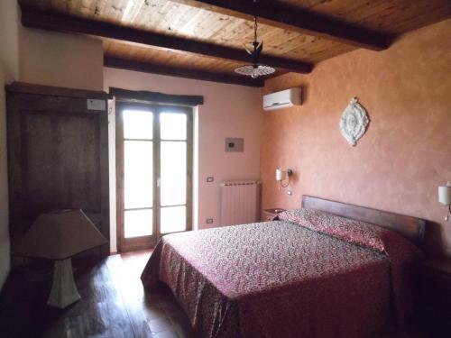 Ένα ή περισσότερα κρεβάτια σε δωμάτιο στο Agriturismo Pinturicchio