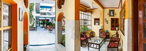 a building with chairs and tables on a street at Hotel Harmony in Khajurāho