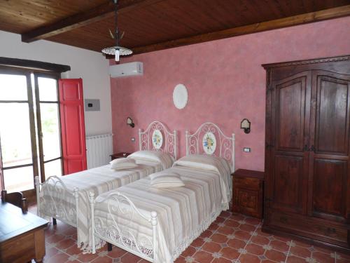Postel nebo postele na pokoji v ubytování Agriturismo Pinturicchio