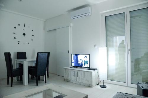 TV a/nebo společenská místnost v ubytování BEST Apartments