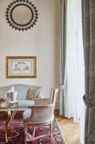 a living room with a couch and a table at Grand Hotel Timeo, A Belmond Hotel, Taormina in Taormina
