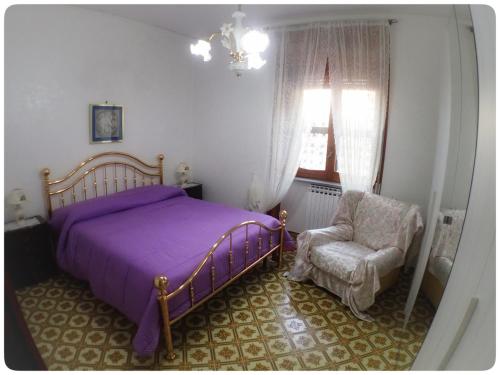 Voodi või voodid majutusasutuse A casa di Tonia toas