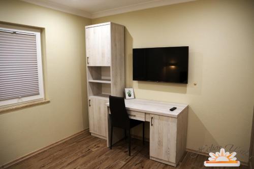 Η κουζίνα ή μικρή κουζίνα στο Helios Apartamenty
