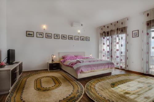 Posteľ alebo postele v izbe v ubytovaní Villa Ladera Lapcici