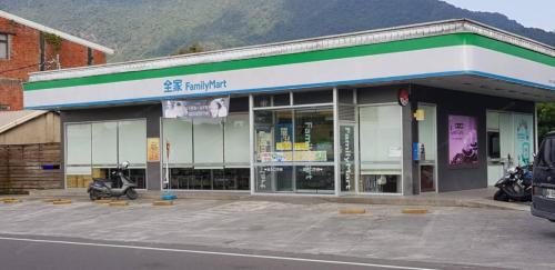 a scooter parked in a parking lot in front of a store at 七號會館 in Puli
