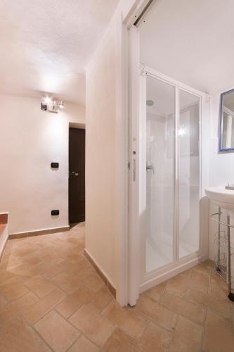 a bathroom with a glass shower and a sink at b&b sotto le torri in Albenga