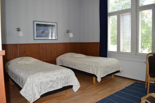 Ένα ή περισσότερα κρεβάτια σε δωμάτιο στο Gasthaus Pooki