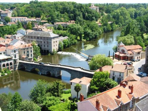 a view of a river in a town with a bridge at Ternélia Henri IV in Clisson