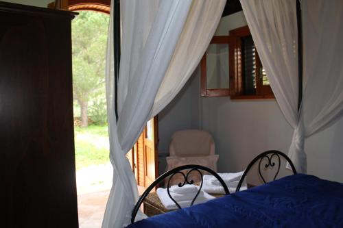 Cama ou camas em um quarto em Villa Mediterraneo